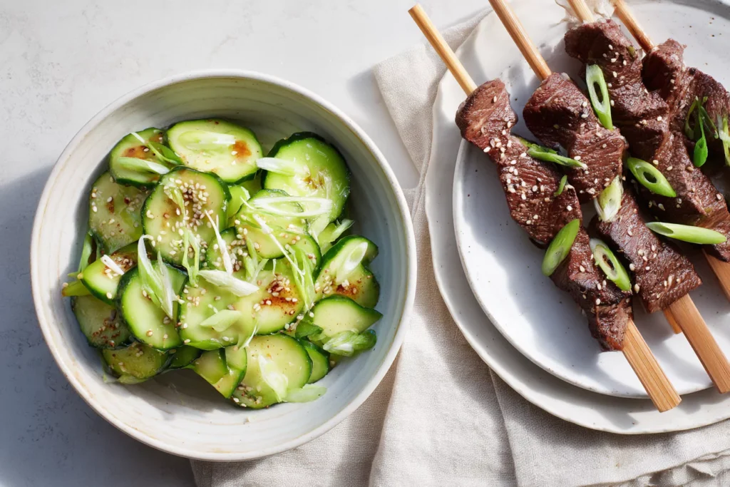 Korean cucumber salad served as a side with grilled beef