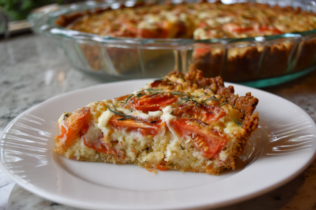 Served slice of Crumb Topped Four Cheese Tomato Pie with garnish