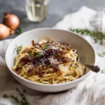 Served caramelized onion pasta with garnish
