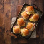 Baked ham and cheese sliders with golden tops