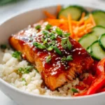 Delicious Honey Sriracha Salmon bowls with rice and vegetables.