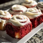 Delicious red velvet cinnamon rolls topped with cream cheese frosting