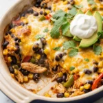 Macro-Friendly Chicken Burrito Bake topped with fresh ingredients