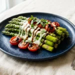 Caprese Asparagus dish with fresh mozzarella, tomatoes, and basil.