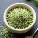 Homemade basil salt recipe with fresh herbs in a bowl
