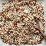 Homemade seasoning salt with fresh basil and tomatoes in a mason jar