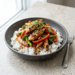 One Pan Chicken Stir Fry with colorful vegetables and chicken in a skillet