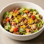 High protein cheeseburger bowl with homemade burger sauce and fresh toppings
