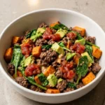 High protein ground beef bowl with roasted sweet potato served in a bowl
