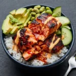 Honey Sriracha Salmon Bowls with vibrant vegetables and rice