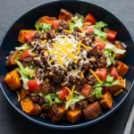 Sweet potato burger bowl with fresh ingredients and toppings